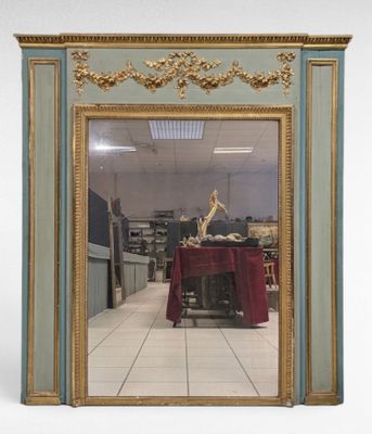 a mirror that is sitting on the floor in a room