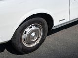 an image of a white car parked in a parking lot