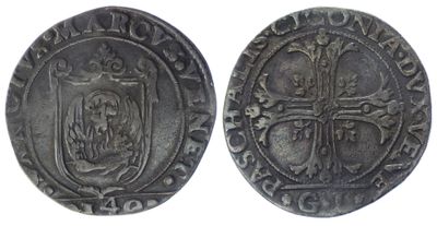 a silver coin with a cross on the front and a shield on the back