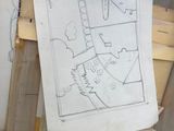 a bunch of drawings on the floor of a room