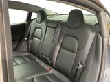 the back seats of a car are empty and the passenger seat is empty