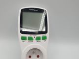 a close up of an electronic device on a white surface