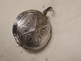 a silver locke with a star design on it