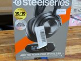 a box of headphones sitting on a wooden table