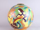 a colorful vase with a picture of a woman on it