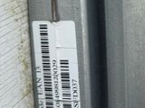 a close up of a metal door with a sticker on it