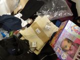 a pile of clothes and other items on the floor