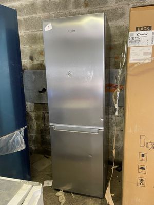 a silver refrigerator and a blue refrigerator in a room