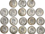 a group of twenty different british coins on a white background