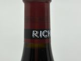 a bottle of wine that is sitting on a table