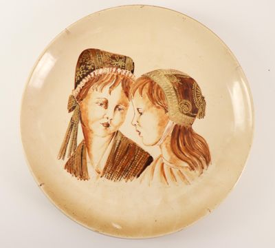 an image of a plate with a picture of two women on it