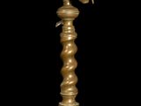 an image of a gold plate with a lamp on top of it