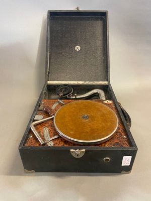 an old record player sitting inside of a suitcase