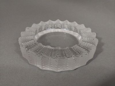 a glass bowl that is sitting on a table