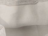 a close up view of a white bag with a zipper on it
