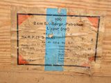 a piece of paper taped to the side of a piece of wood
