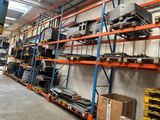 a room with a lot of shelves and pallets in it