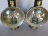 pair of black and gold lamps on a white background