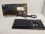 a black keyboard and a black mouse on a white table