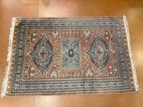 a rug on a wooden floor with a brown floor