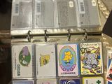a suitcase full of cards and other items on a table