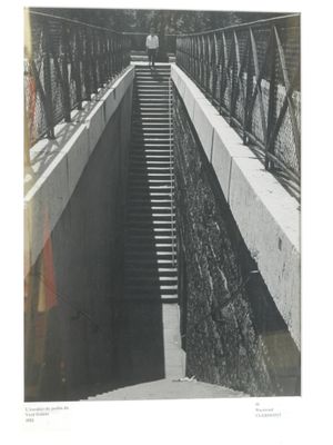 a black and white photo of a bridge with stairs