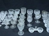 a lot of glasses that are sitting on a table