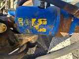 a close up of a blue machine with a yellow sign on it