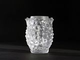 a close up of a glass vase on a table