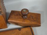 three pieces of wood that are sitting on a table
