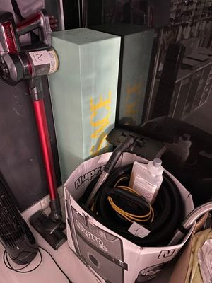 a box with a vacuum and a bag with a hose