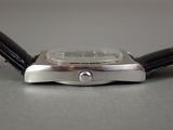 a close up of a watch on a table