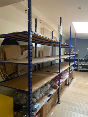 a room with a lot of boxes and boxes on the shelves