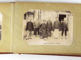 an old photo of a group of men standing next to each other