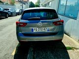 a silver car parked on the side of the road