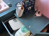 a kitchen with a sink and a counter with a toaster and toaster in it