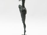 an image of a bronze statue of a woman holding a bird