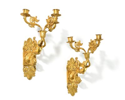 pair of antique gold plated sconces on a white background