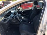the interior of a car with the door open and the driver ' s seat down