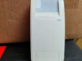 a small white device sitting on top of a black box