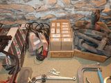 a box of tools sitting on the floor next to a box of tools