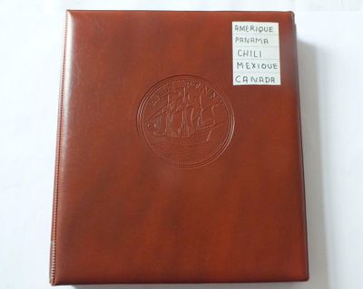 brown leather album with a picture of a ship on the cover