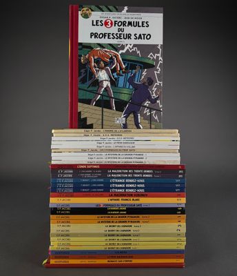 many books stacked on top of each other on a table