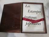 a picture of a box with a red ribbon in it