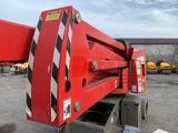 a red crane that is parked in a parking lot