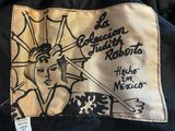a close up of a label on a jacket with an image of a woman