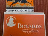two boxes of cigarettes sitting on top of each other on a table