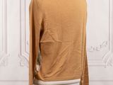 an image of a mannequin mannequin with a brown sweater on it