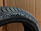 a close up of a tire on a cardboard box with a box in the background