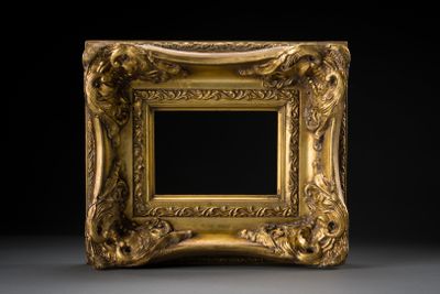 an ornate gold frame with a black background